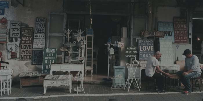 old signs for sale with men playing a game